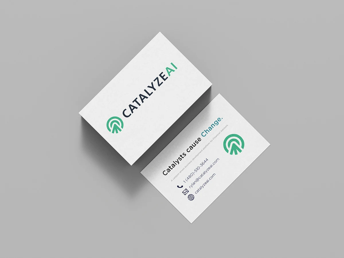 Mockup of the Catalyze AI business card: green arrow logo on the front, “Catalysts cause Change.” and contact details on the back