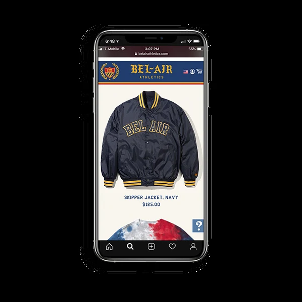Phone mockup of the Bel-Air Athletics online store showing the navy Skipper jacket