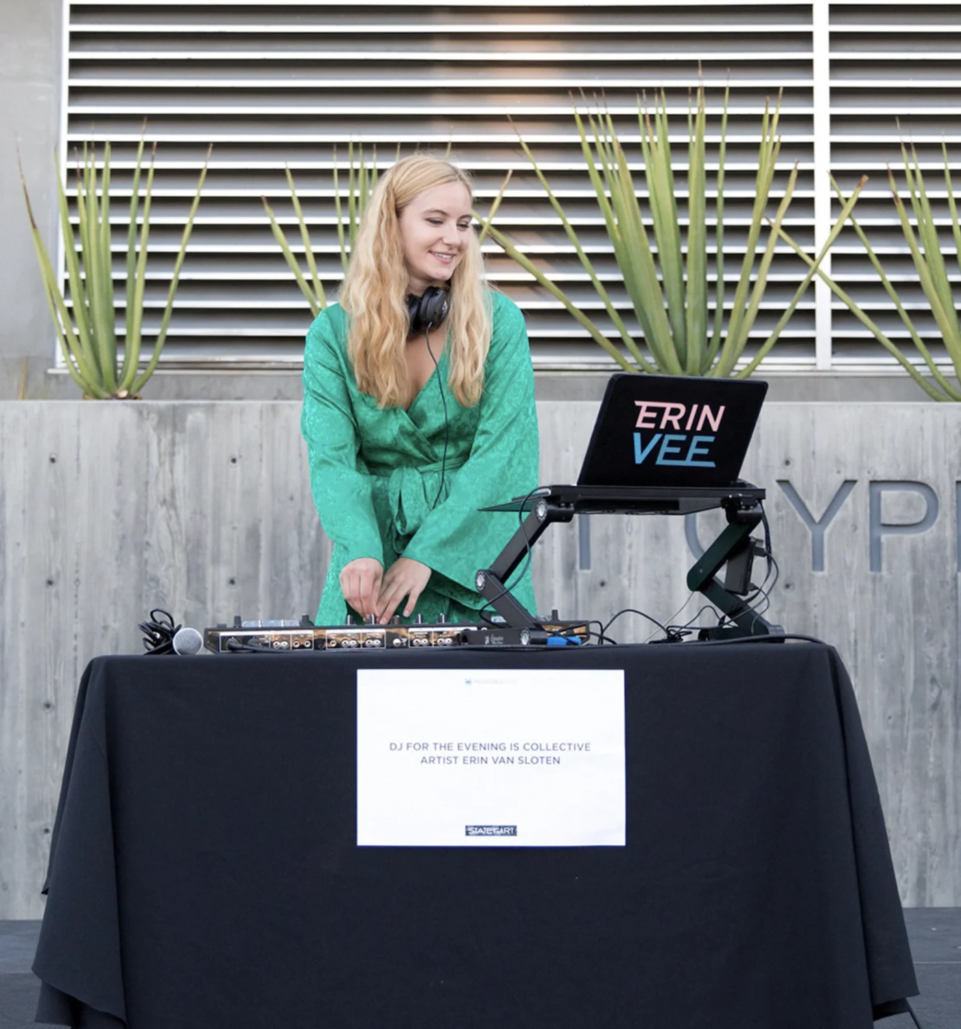 DJ table sign: DJ for the evening is collective artist Erin Van Sloten
