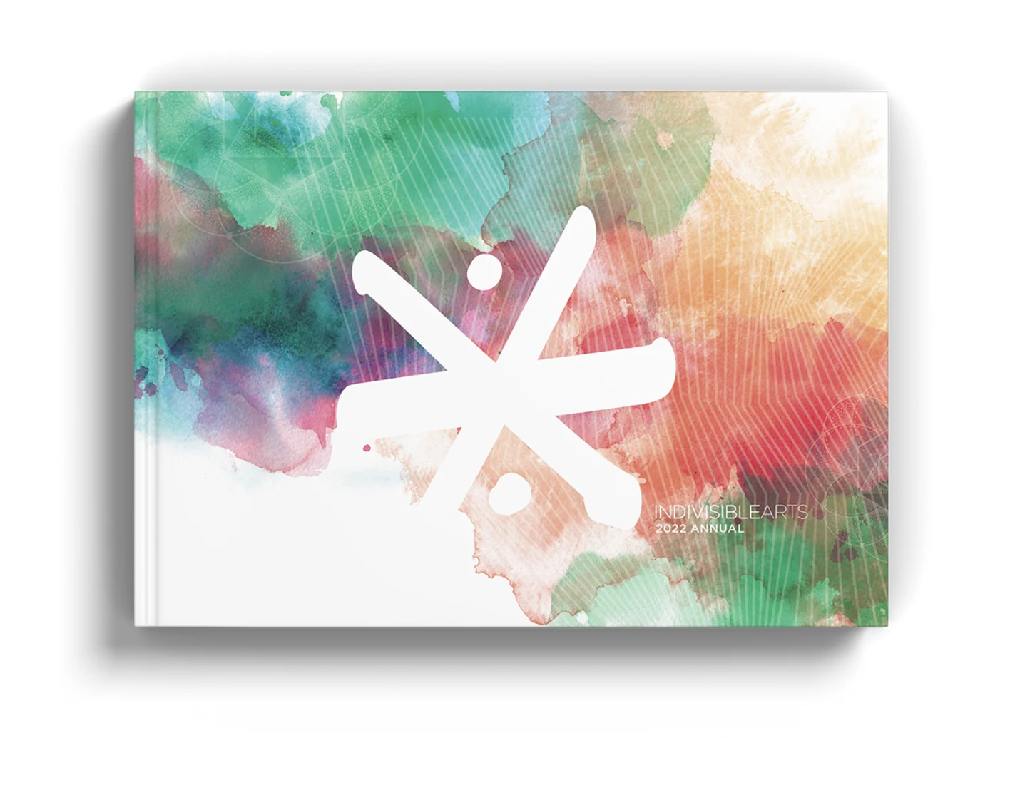 Indivisible Arts 2022 Annual book cover: a white asterisk logo over green, pink and orange watercolor