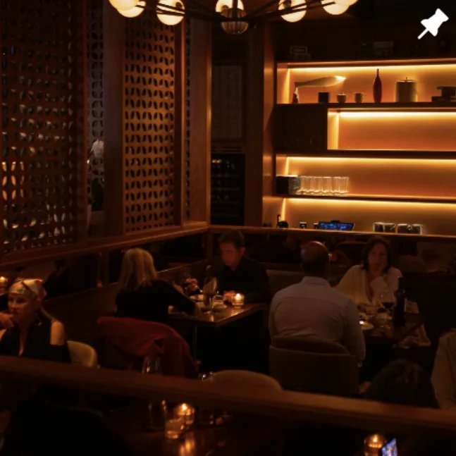 Candlelit dining room with glowing shelves
