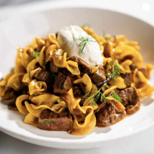 Egg noodles with braised beef from a restaurant shoot