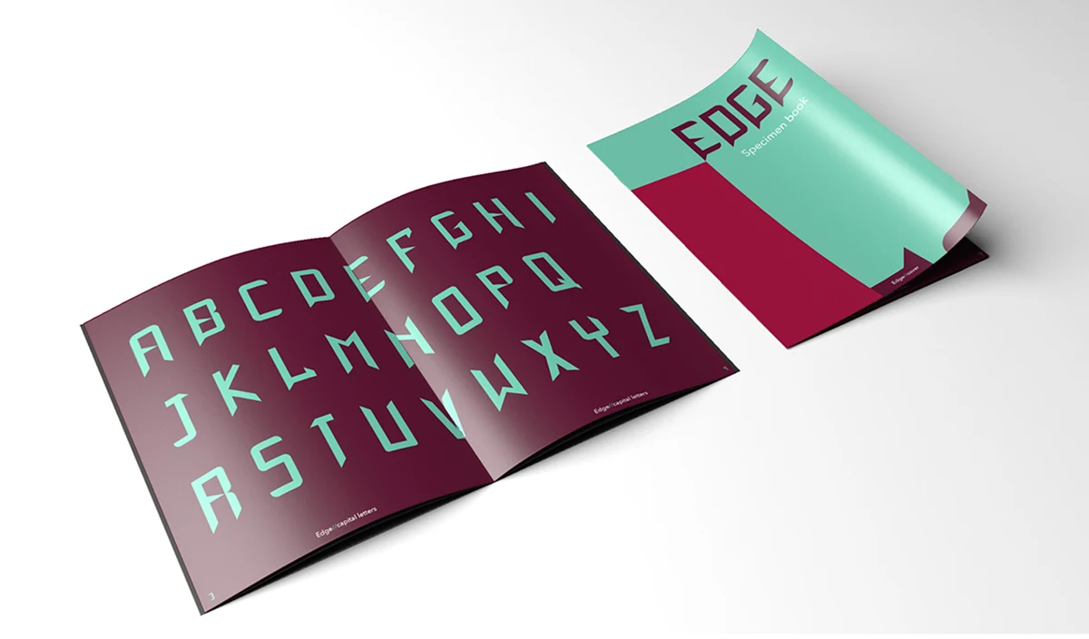 EDGE specimen book open to the capital letters in mint on deep plum, beside its mint and red cover